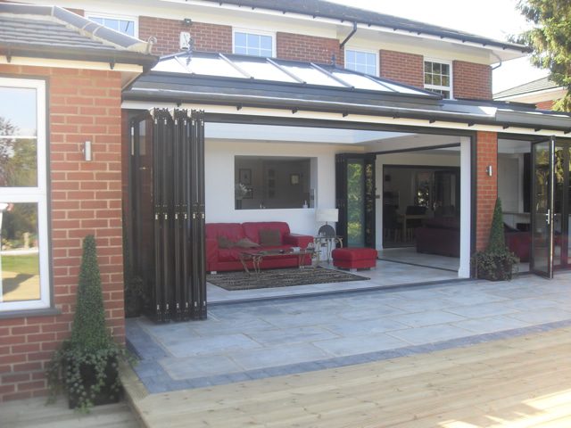 an excellent example of several sets of bifolding doors by micron that can create rooms and one open space