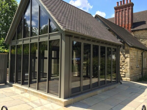 aluk bifolding doors made by alufold direct in grey in a cheltenham coffee shop