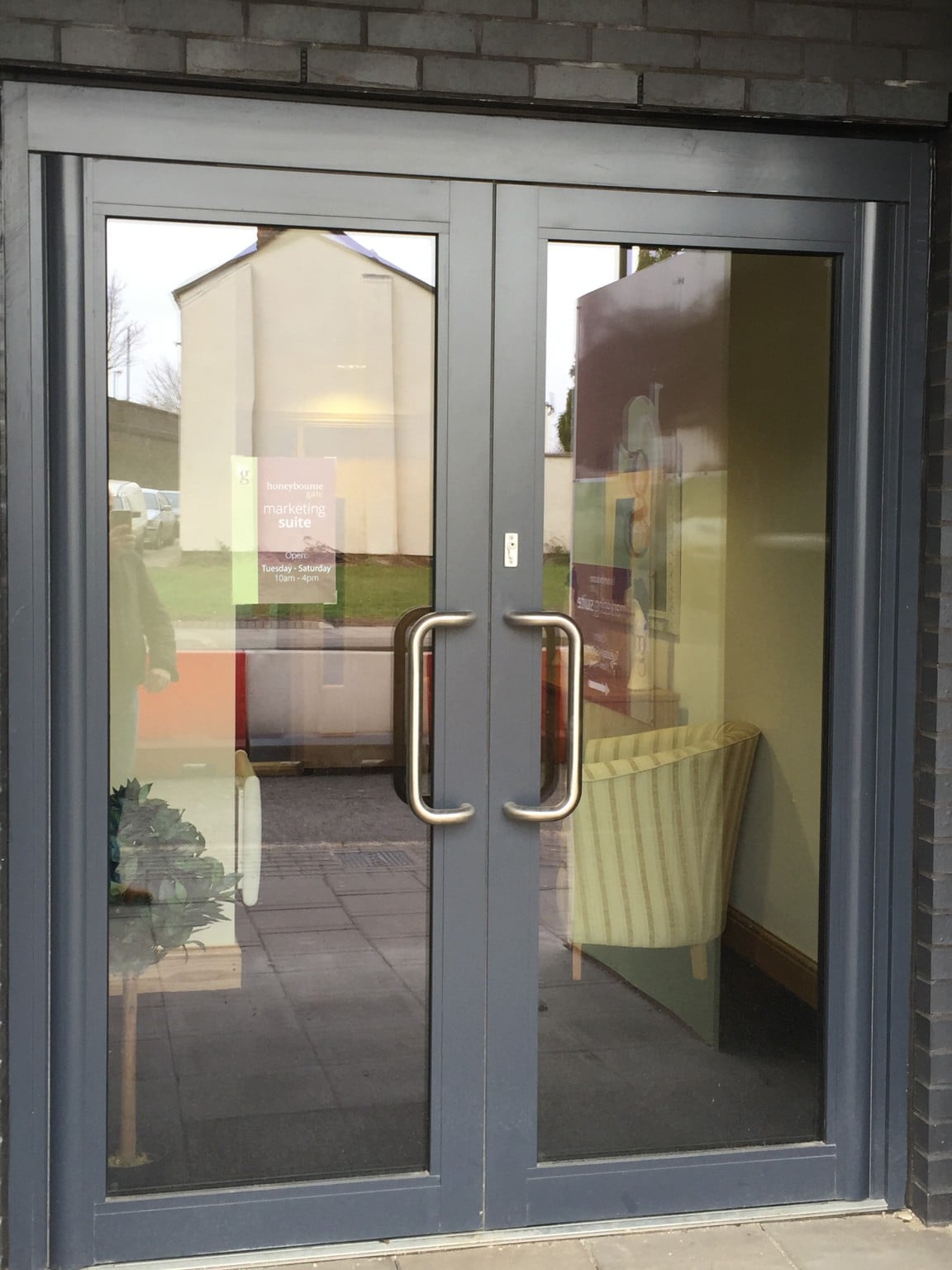 these doors are a main entrance to a recently built retirement village but are in the same colour with contrasting handles.