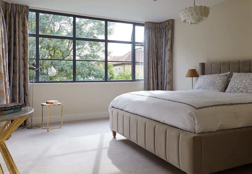 aluk residential systems windows showing a bedroom with a new slim window