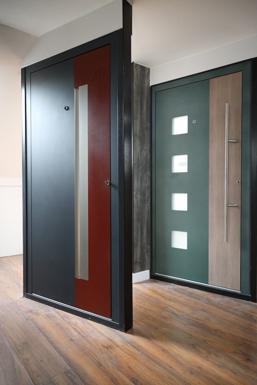 aluminium doors in a showroom in grey and maroon colours