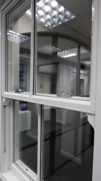 aluminium sliding sash windows in a showroom