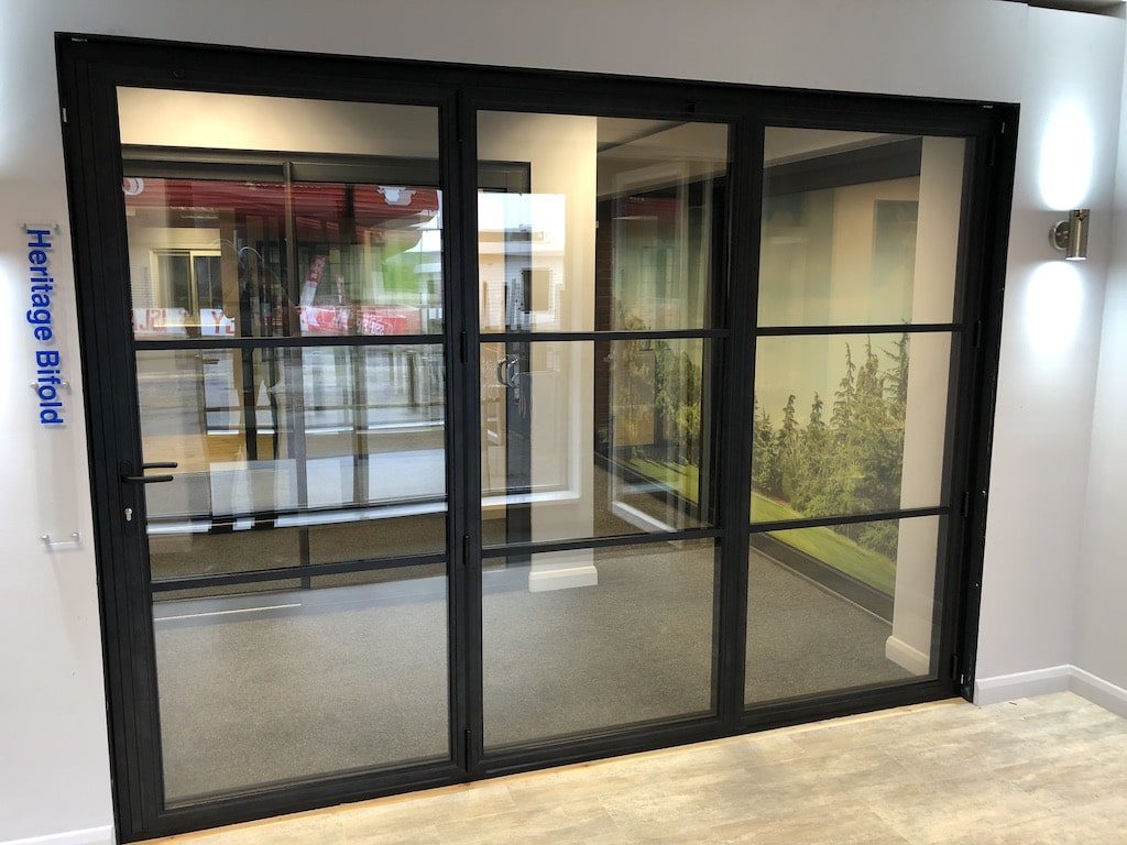 steel-look bifolding doors made by duration windows in a showroom