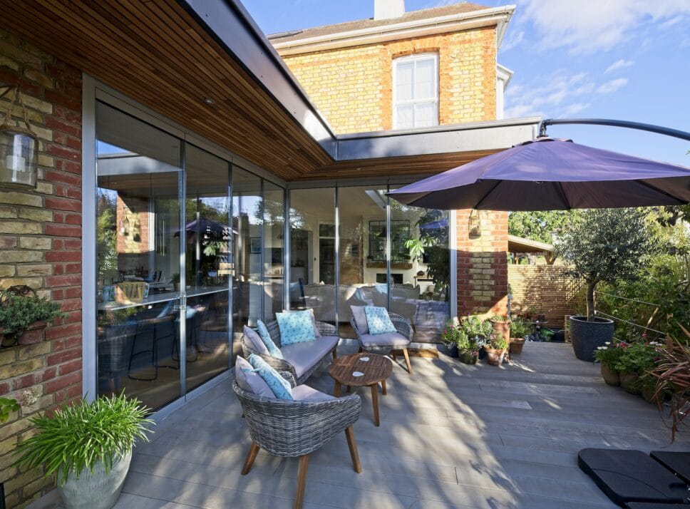 frameless slide and turn patio doors in a character home