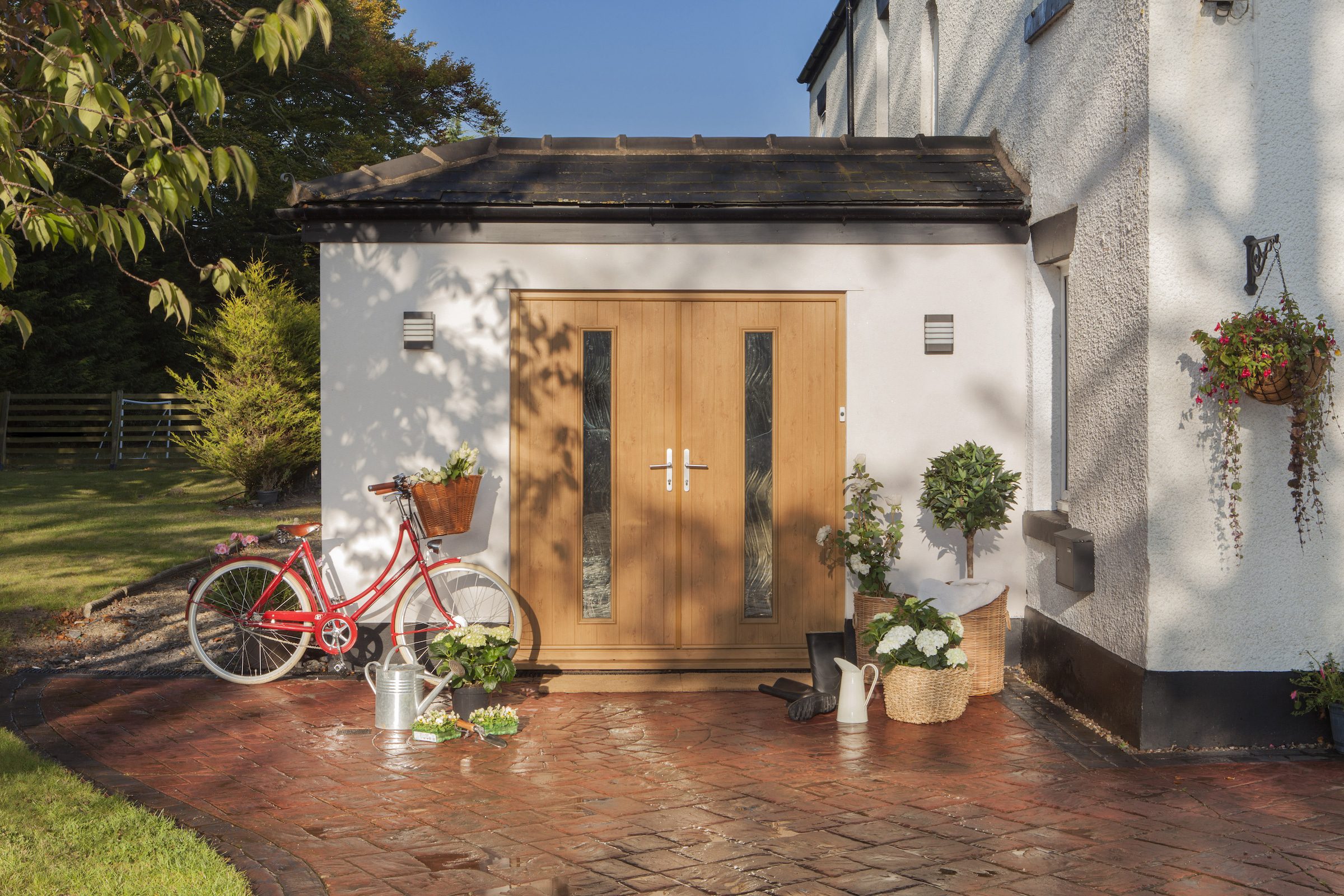 composite front doors in a wood design to a cottage