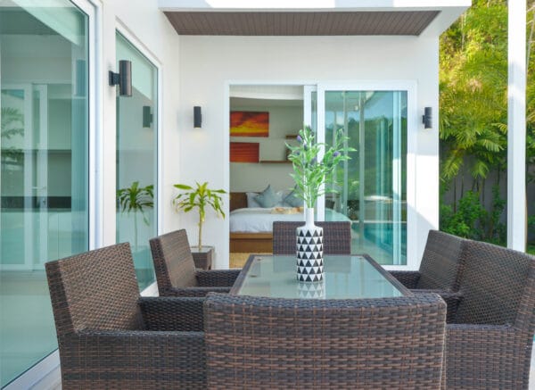 white open patio doors on a patio with garden furniture