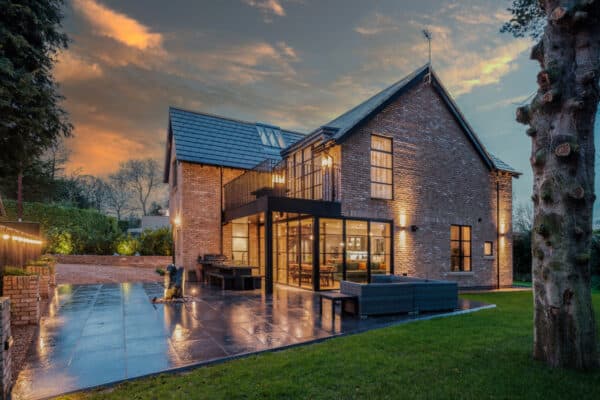 picture of new house at dusk with steel styles windows and doors