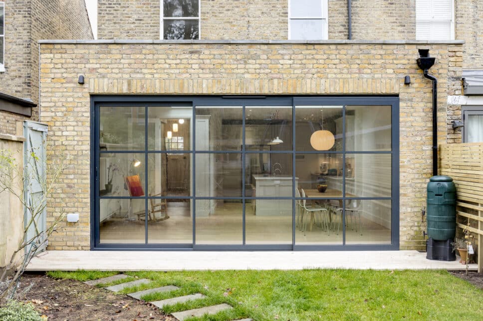 steel-look sliding doors showing a sunflex patio door in a brick extension.