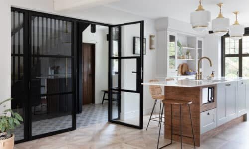 aluco steel look internal doors in a kitchen renovation with tiled floor and kitchen island