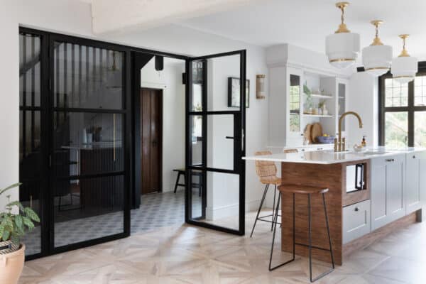 aluco steel look internal doors in a kitchen renovation with tiled floor and kitchen island