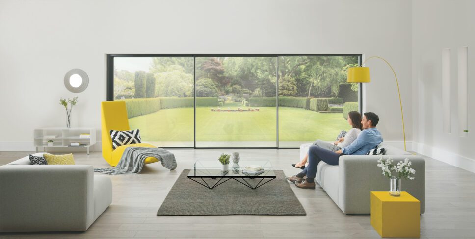 os-20 artisan origin sliding doors showing a couple looking out onto a lawn