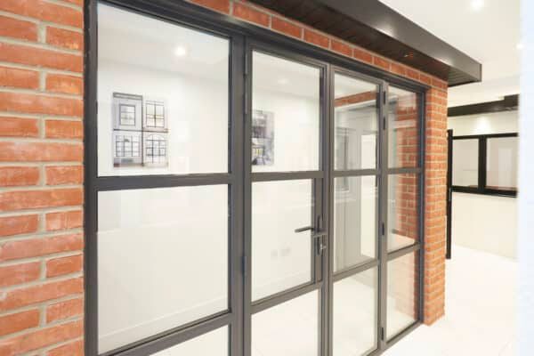 steel-look french doors and side panels made by chigwell window centre in their loughton showroom
