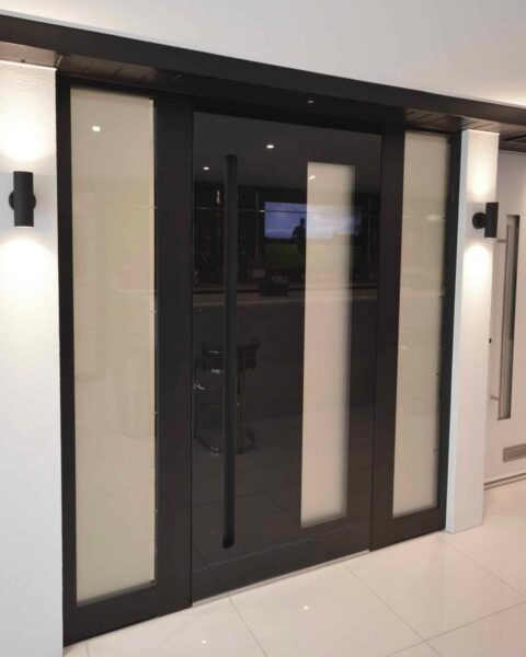 black gloss aluminium front door with side panels in 6 day doors showroom